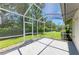 Screened in patio overlooking a lush green lawn perfect for relaxation and entertaining at 4313 Carol Ann Rd # 20, Sarasota, FL 34233