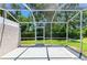 Screened patio overlooking a green lawn and landscaping at 4313 Carol Ann Rd # 20, Sarasota, FL 34233