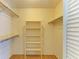 Walk-in closet with built-in shelving and ample storage space at 4313 Carol Ann Rd # 20, Sarasota, FL 34233