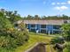 A beautiful view of the rear of the townhomes with balconies overlooking a tranquil pond at 4548 Chinkapin Dr, Sarasota, FL 34232