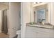 Bathroom features a white vanity, granite countertop, and shower with a curtain at 4548 Chinkapin Dr, Sarasota, FL 34232