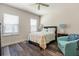 Light and airy bedroom with wood-look floors, bright windows and coastal decor at 4548 Chinkapin Dr, Sarasota, FL 34232