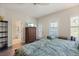 Bright primary bedroom has wood floors and adjoins the bathroom at 4548 Chinkapin Dr, Sarasota, FL 34232