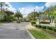 Hammock Park: An Ashton Woods Community entrance sign with palm trees and gated entry at 4548 Chinkapin Dr, Sarasota, FL 34232