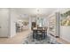 Dining room with bookshelf and view to the kitchen and stairs at 4548 Chinkapin Dr, Sarasota, FL 34232