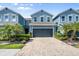 Charming two-story townhome featuring a two-car garage, brick driveway, and well-maintained landscaping at 4548 Chinkapin Dr, Sarasota, FL 34232