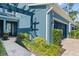 The home's exterior features professionally landscaped beds and a covered entryway at 4548 Chinkapin Dr, Sarasota, FL 34232