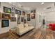 Hallway featuring eclectic artwork and stylish wood-look flooring at 4548 Chinkapin Dr, Sarasota, FL 34232