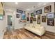 Bright hallway decorated with unique art and featuring stylish flooring at 4548 Chinkapin Dr, Sarasota, FL 34232