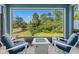 Scenic screened lanai with comfortable seating and a picturesque view at 4548 Chinkapin Dr, Sarasota, FL 34232