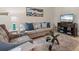 Comfortable living room with modern decor and a large flat-screen television at 4548 Chinkapin Dr, Sarasota, FL 34232