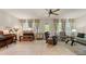 Bright living room with ceiling fan, tile floors and natural light at 4548 Chinkapin Dr, Sarasota, FL 34232