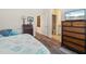 Main bedroom features stylish decor, wood-look floors and an ensuite bathroom at 4548 Chinkapin Dr, Sarasota, FL 34232