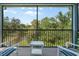 Screened in porch with a view of the water and lots of trees at 4548 Chinkapin Dr, Sarasota, FL 34232