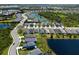 An aerial view captures a Primary-planned community with winding roads, lakes, and manicured lawns at 4815 Deep Creek Ter, Parrish, FL 34219
