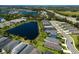 Gorgeous aerial view of a residential community featuring lakefront homes and lush landscaping at 4815 Deep Creek Ter, Parrish, FL 34219