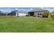 Expansive backyard with lush green lawn and metal fence offers plenty of space for outdoor activities at 4815 Deep Creek Ter, Parrish, FL 34219