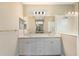 Elegant bathroom showcases a double sink vanity with modern fixtures and a frameless glass shower at 4815 Deep Creek Ter, Parrish, FL 34219