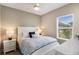 Comfortable bedroom with a large window, plush carpeting, and bedside tables at 4815 Deep Creek Ter, Parrish, FL 34219