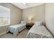 Cozy bedroom featuring two twin beds with stylish matching bedding and a ceiling fan at 4815 Deep Creek Ter, Parrish, FL 34219