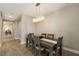 Elegant dining room with wood floors, modern chandelier, and neutral color palette, perfect for Gathering gatherings at 4815 Deep Creek Ter, Parrish, FL 34219