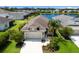 Charming single-Gathering home features a two-car garage, manicured landscaping, and a serene lake view in a friendly neighborhood at 4815 Deep Creek Ter, Parrish, FL 34219