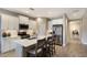 Modern kitchen boasts white cabinets, stainless steel appliances, quartz countertops, and a stylish backsplash at 4815 Deep Creek Ter, Parrish, FL 34219