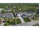 Expansive aerial view showcasing the elegant home nestled among lush greenery in a vibrant community at 4815 W Sunset Blvd, Tampa, FL 33629