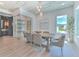 Elegant dining room featuring custom lighting and a temperature controlled wine room at 4815 W Sunset Blvd, Tampa, FL 33629