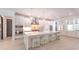 Bright kitchen features a large central island with marble countertops and stainless steel appliances at 4815 W Sunset Blvd, Tampa, FL 33629
