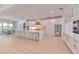 Open kitchen with large island, stainless steel appliances, and adjacent breakfast area with outside view at 4815 W Sunset Blvd, Tampa, FL 33629