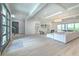 Airy living room with light floors, a cozy sofa, and a large balcony for outdoor relaxation at 4815 W Sunset Blvd, Tampa, FL 33629