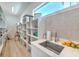 Open pantry with custom shelves, sink, and ample storage space for organizing kitchen essentials at 4815 W Sunset Blvd, Tampa, FL 33629