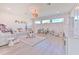 Spacious playroom is decorated with whimsical polka dots, featuring bright windows, and ample toy storage at 4815 W Sunset Blvd, Tampa, FL 33629