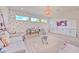 Bright playroom includes polka dots, large windows, toy storage, white couches, and a table with chairs at 4815 W Sunset Blvd, Tampa, FL 33629