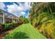 Expansive lawn in the backyard offers plenty of room for outdoor activities at 4912 Sabal Lake Cir, Sarasota, FL 34238