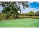 Outdoor basketball court surrounded by lush foliage offers recreational opportunities at 4912 Sabal Lake Cir, Sarasota, FL 34238