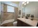 Updated bathroom featuring tiled shower and bathtub at 4912 Sabal Lake Cir, Sarasota, FL 34238