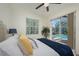 Bedroom with sliding glass doors to the screened in pool at 4912 Sabal Lake Cir, Sarasota, FL 34238