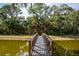 Scenic bridge crossing a tranquil lake, surrounded by lush foliage at 4912 Sabal Lake Cir, Sarasota, FL 34238