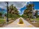 Central Sarasota Pky featuring palm trees and a crosswalk at 4912 Sabal Lake Cir, Sarasota, FL 34238