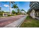 Well-maintained Turtle Rock community entrance, featuring brick roadways and mature landscaping at 4912 Sabal Lake Cir, Sarasota, FL 34238