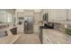 Modern kitchen featuring stainless steel appliances, granite counters, and ample cabinet space at 4912 Sabal Lake Cir, Sarasota, FL 34238