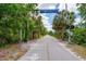 Legacy Trail with palm trees and crosswalk at 4912 Sabal Lake Cir, Sarasota, FL 34238