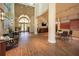 Bright lobby boasts seating areas, skylight, and updated flooring at 4912 Sabal Lake Cir, Sarasota, FL 34238