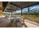 Covered patio provides comfortable seating and scenic lake views at 4912 Sabal Lake Cir, Sarasota, FL 34238