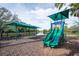 Community playground features slides and swings, perfect for children to play and enjoy the outdoors at 4912 Sabal Lake Cir, Sarasota, FL 34238