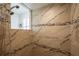 Walk-in shower featuring decorative tile and dual shower heads at 4912 Sabal Lake Cir, Sarasota, FL 34238