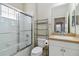 Bathroom with glass enclosed shower, commode and vanity sink at 5227 Aqua Breeze Dr, Bradenton, FL 34208