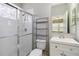 Bathroom with glass enclosed shower, commode and vanity sink at 5227 Aqua Breeze Dr, Bradenton, FL 34208